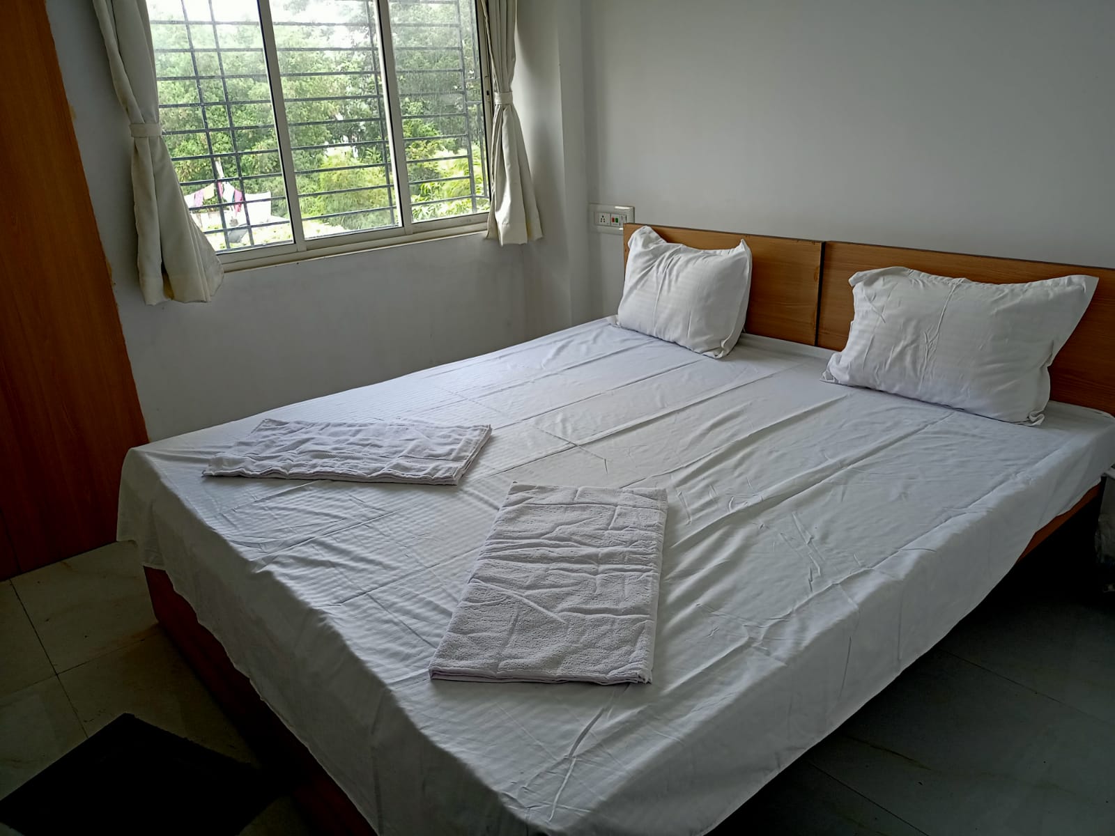 Well-lit Bedroom with Natural Sunlight & Wardrobe