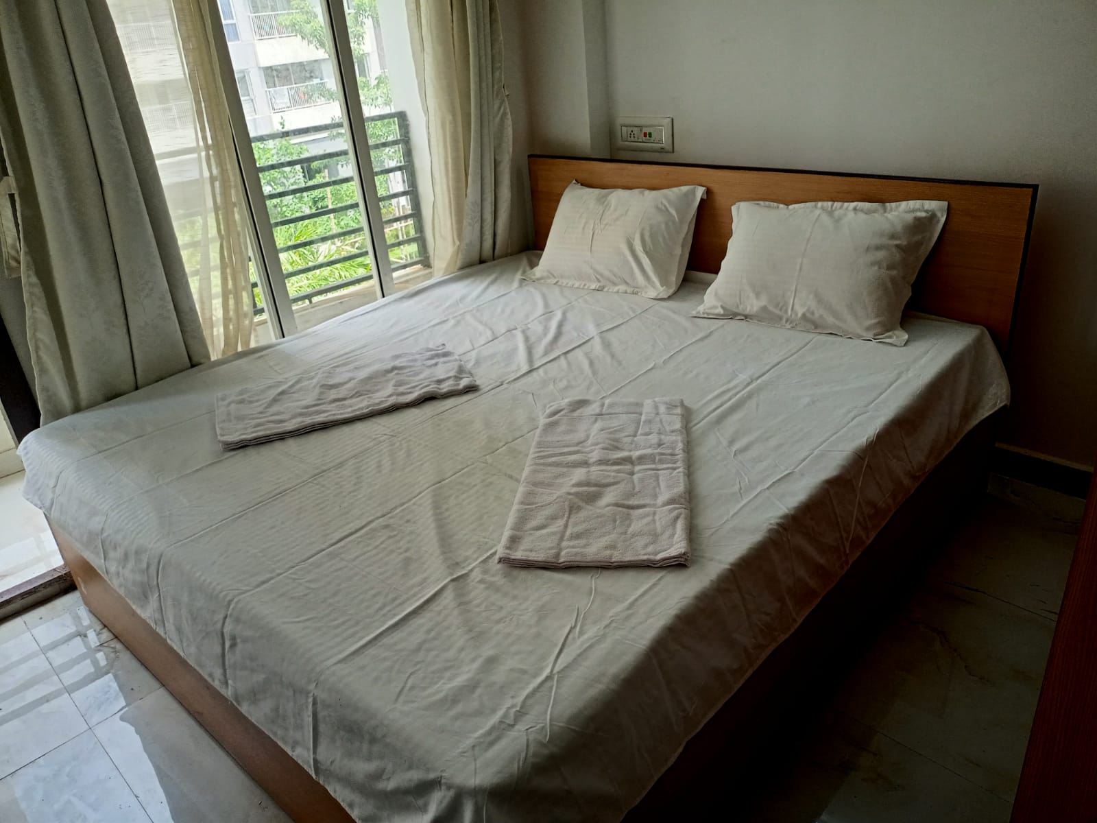Comfortable Double Bed with Balcony Access